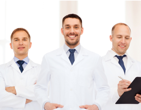 group of smiling male doctors in white coats with clipboard