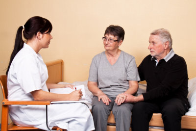 elderly couple consulting to a doctor